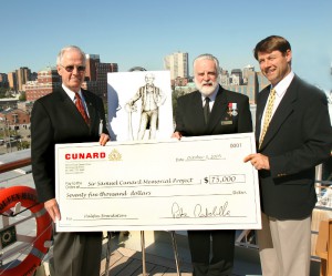 Cheque presentation aboard Queen Mary 2, Halifax, Nova Scotia October 3, 2005. L to R:Hon. Alan Abraham (Chairman), Commodore R.W. Warwick (Honourary Chairman) and John G. Langley Q.C. (member) Samuel Cunard Memorial Committee